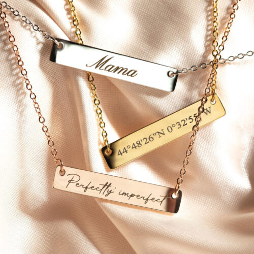 Personalized stainless steel bar pendant necklaces with custom name engraving in gold, rose gold, and silver finishes.